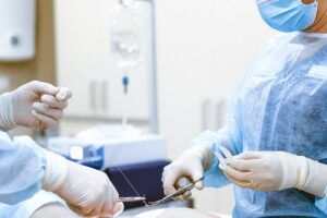 Photo of Medical Professionals Wearing Personal Protective Equipment